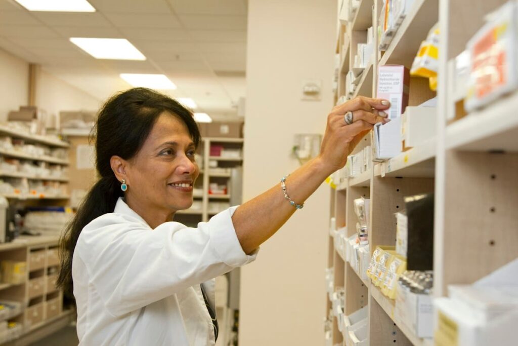 Pharmacy counter with a paper prescription, showing that PEP in Thailand needs a doctor's prescription first