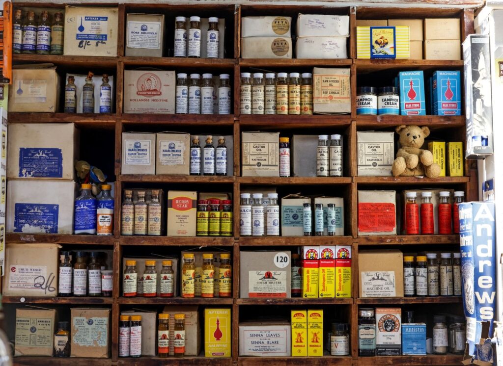 Pharmacy shelves with medicine boxes, showing why PEP in Thailand needs a doctor, not an over-the-counter purchase