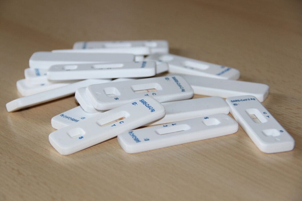 Rapid HIV test cassette on a clinic table used for follow-up testing after PEP