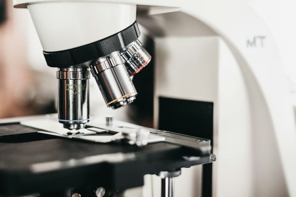 Laboratory microscope and samples, representing combined HIV and STI testing on Koh Samui