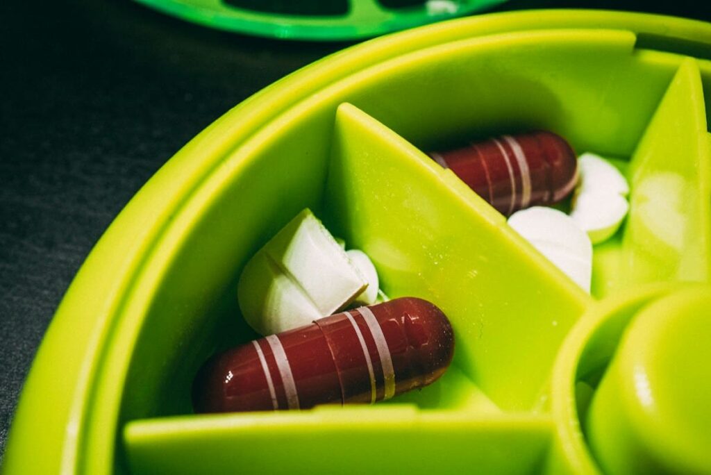 Weekly pill organiser, representing daily PrEP as ongoing HIV prevention after missing PEP