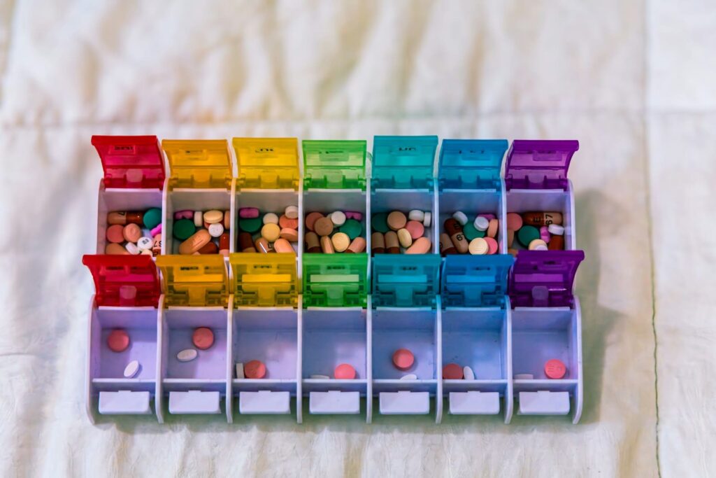 Colourful weekly pill organiser, illustrating the cost of a 28-day HIV PEP course on Koh Samui