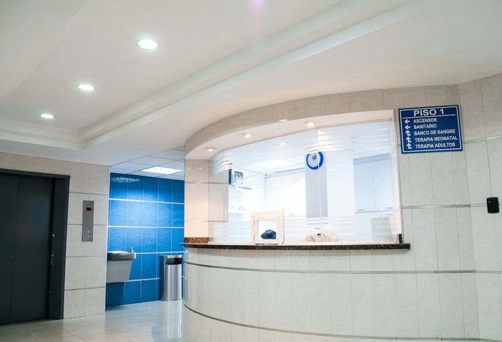 Clinic reception desk with a service list, showing how PEP cost on Koh Samui is made up of several parts