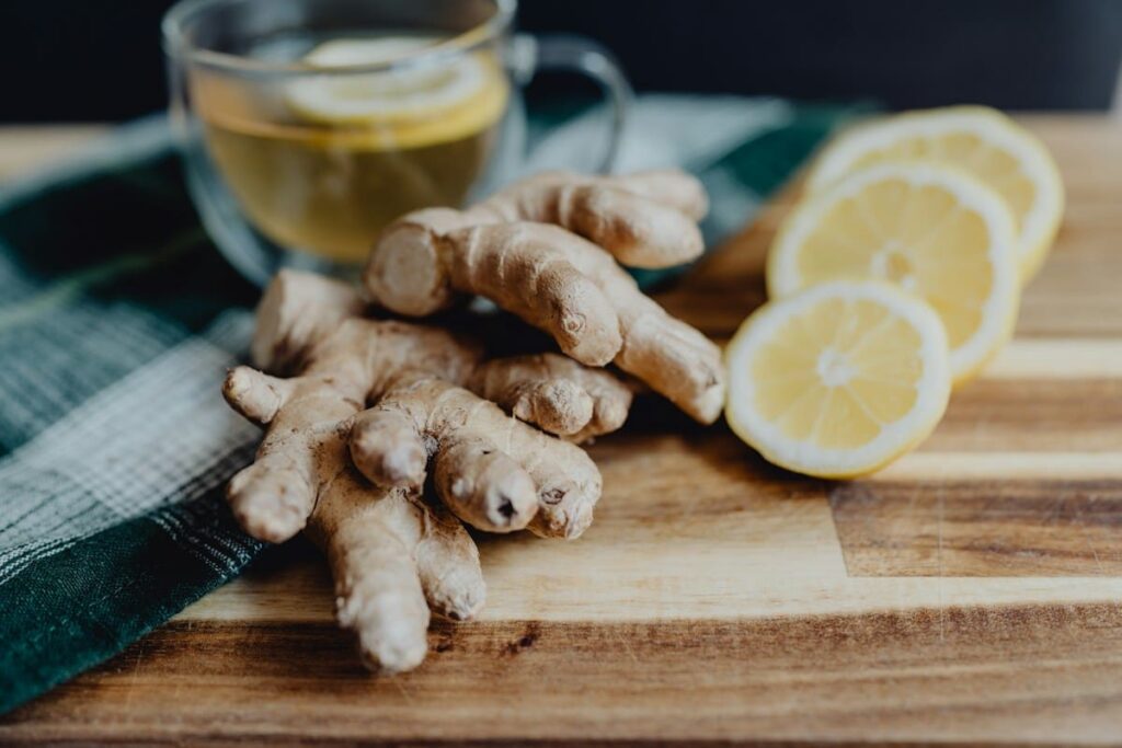 Cup of ginger tea on a table, a simple self-care idea for nausea as a PEP side effect