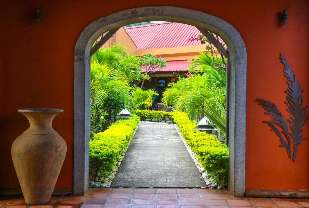 Garden path through an arched entrance, representing a quiet, private place for STD testing