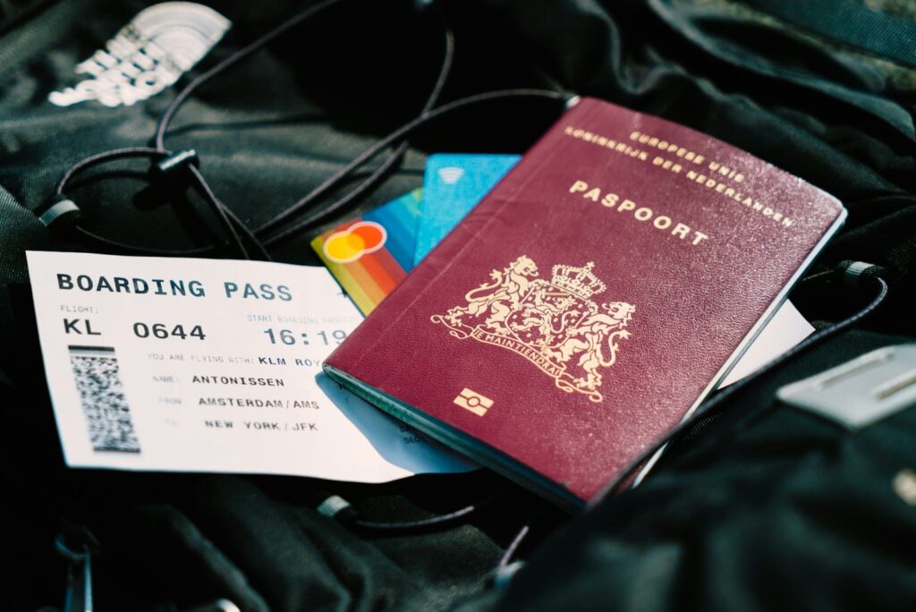 Passport and boarding pass on a bag, ready for a trip, representing sexual health planning for Thailand travellers