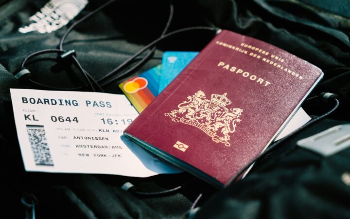 Passport and boarding pass on a bag, ready for a trip, representing sexual health planning for Thailand travellers