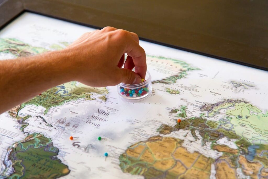 World map with coloured pins, representing sexual health risks and STD statistics for Thailand travellers