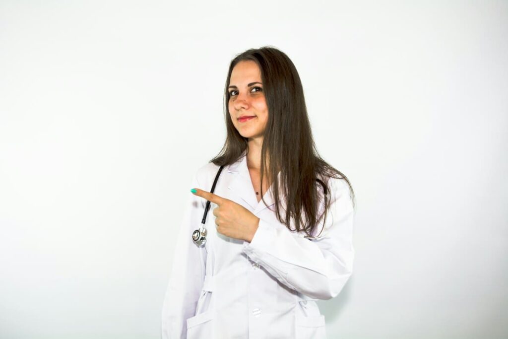 Doctor pointing to the side while explaining what a syphilis test result means