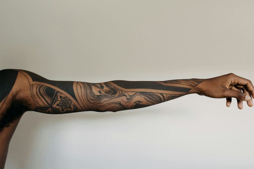 Forearm with a fresh tattoo, where good aftercare lowers skin infection risk