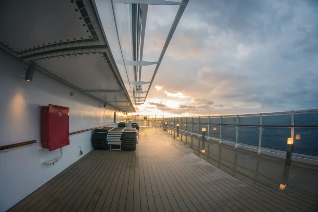 Railing on a ferry deck at sea, a reminder that travellers can plan tattoo-related testing between islands